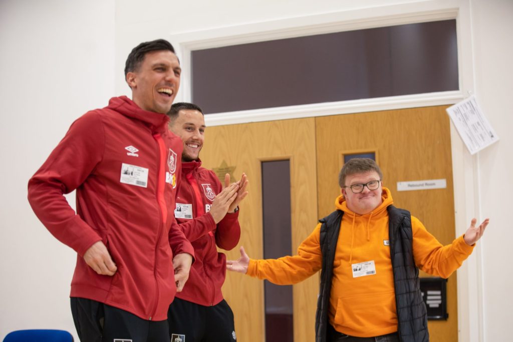 Burnley fc in the community launch new Burnley fc socks with stand out socks with the support of Josh Brownhill and Jack Cork