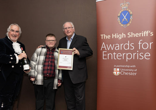 the high sheriff of Cheshire, a man with down syndrome and pete waterman at high sheriff awards