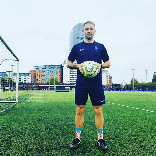 RAF football Captain Lewis Brownhill looking fabulous and starting conversations about #disabillityinclusion in the #manchester bees socks by Stand out socks 