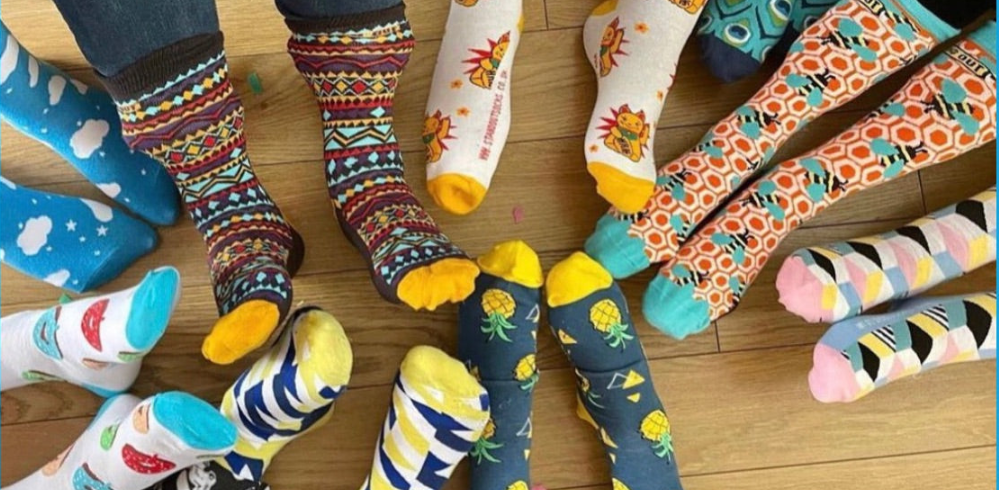 Various Feet with Stand Out Socks for World Down Syndrome Day