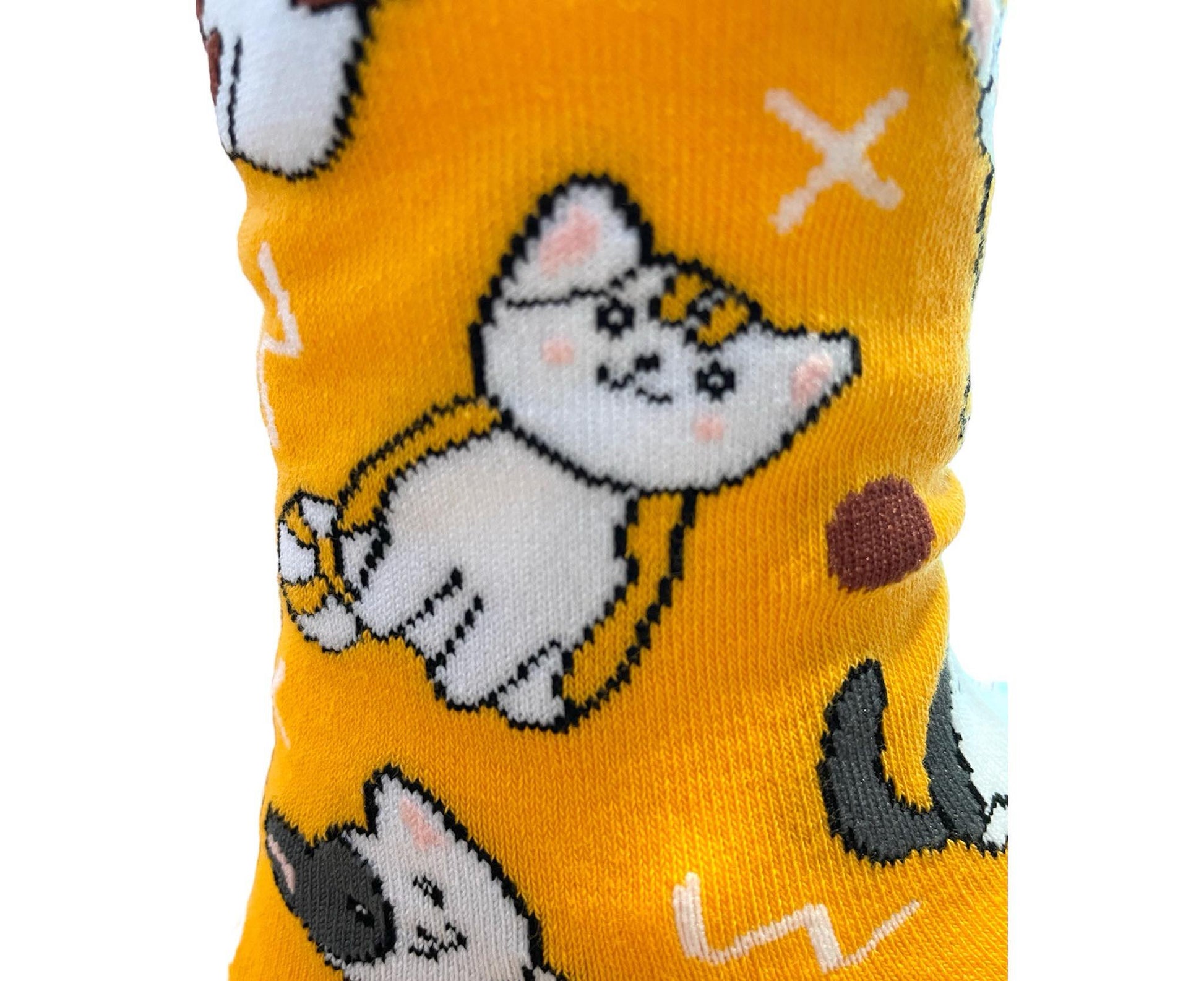 Clos up of orange sock with cat pattern and a stand out logo