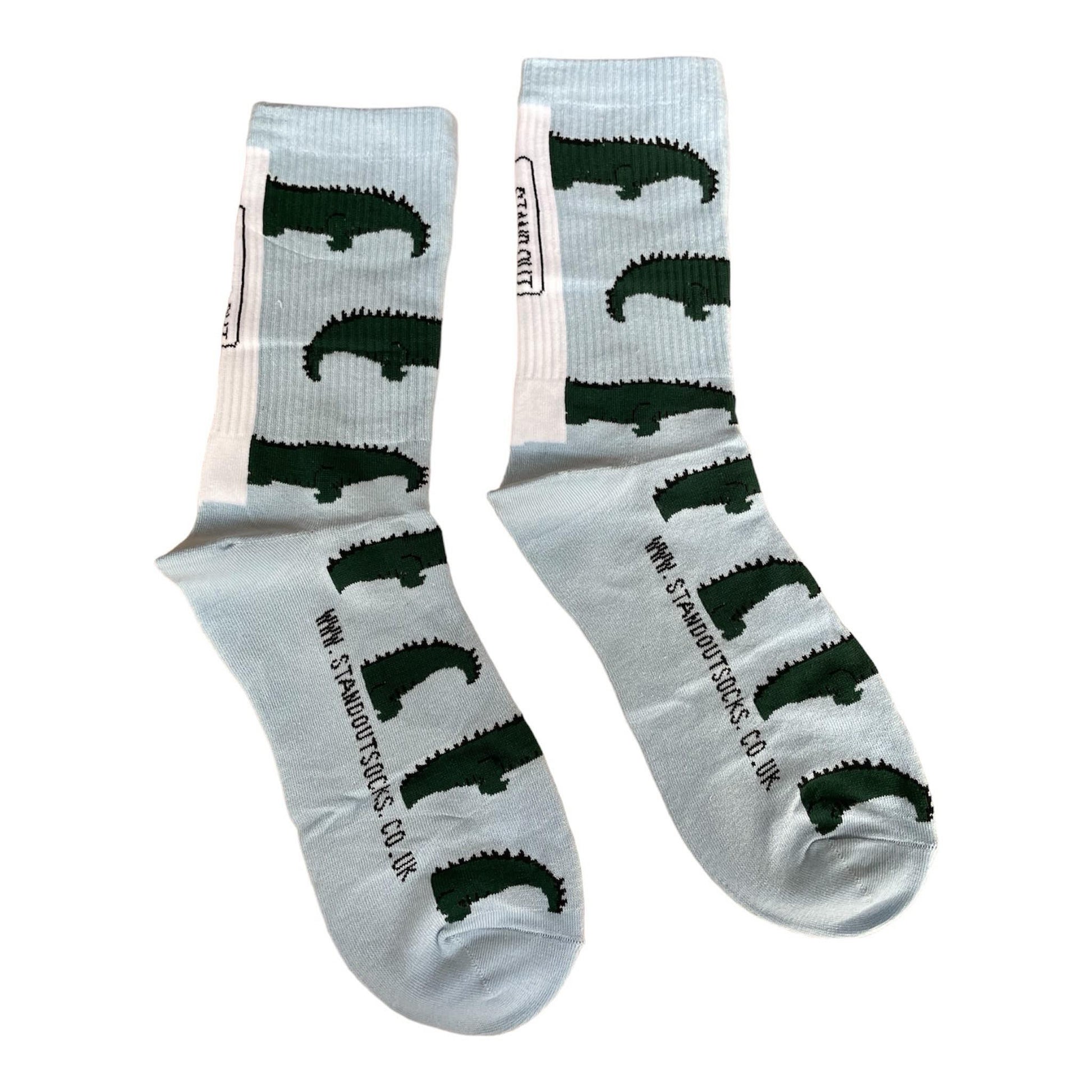 colourful sports socks blue with green crocodiles featuring the stand out socks website and logo