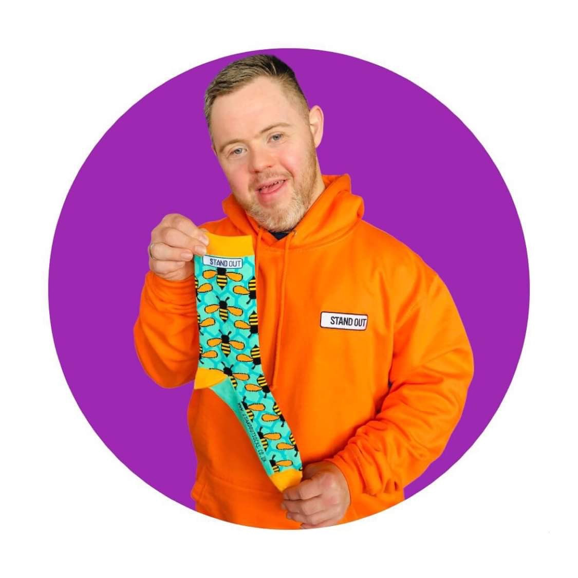 Oliver From Stand Out Socks Holding Manchester Bee Socks