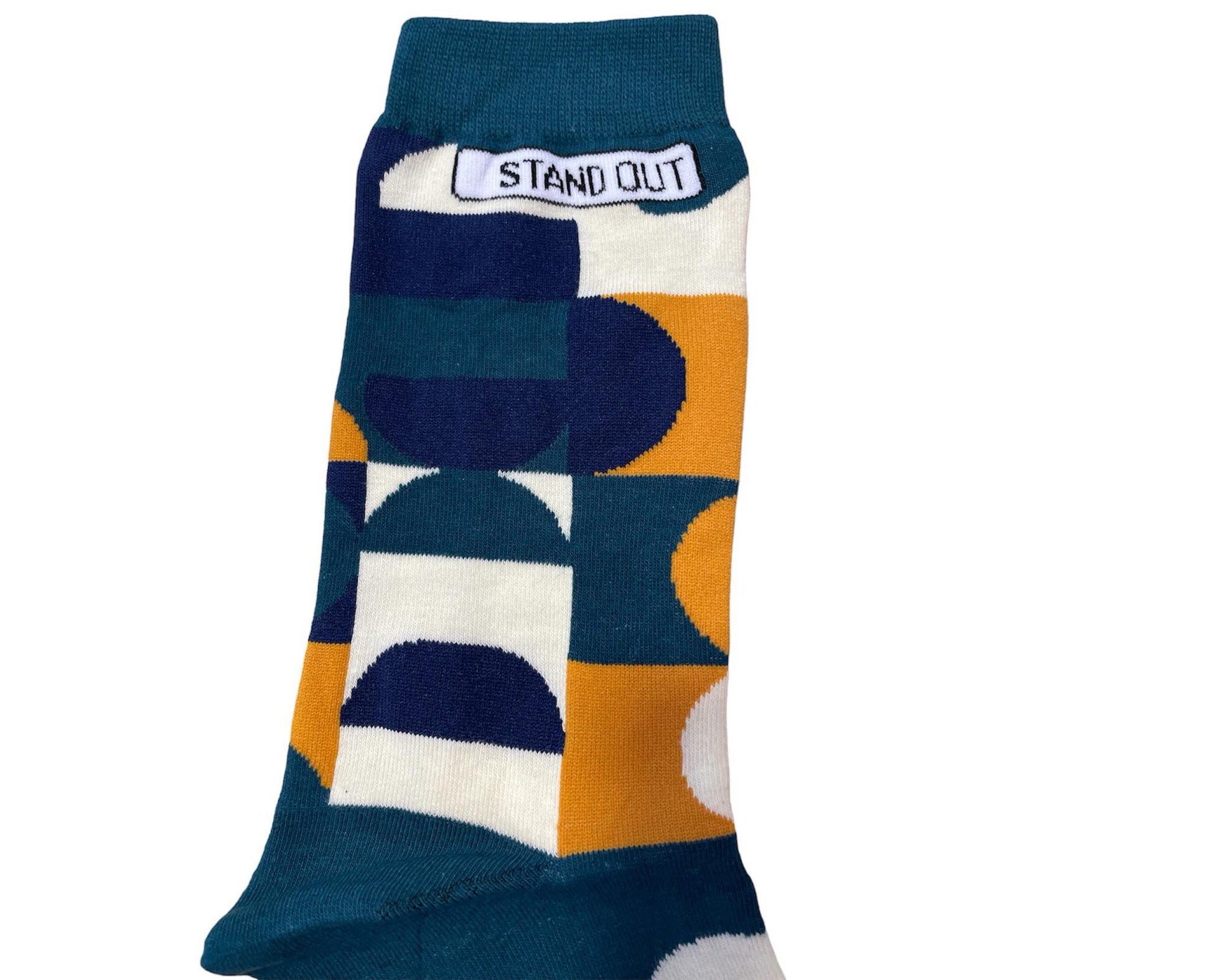 Green Socks with Orange, cream and navy geometric pattern by Stand Out Socks. The Stand Out logo on the top with the Stand Out website on the sole.